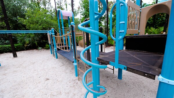 Bright blue twisted bars and climbing ropes on a playground at Disney's All-Star Sports Resort