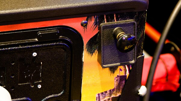 Close-up of a pull handle on a pinball machine