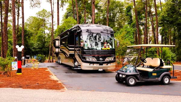 Bus and electric-powered cart at Disney's Fort Wilderness Resort