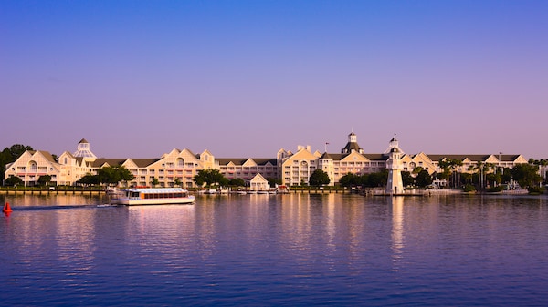 View from the lake at Disney's Yacht Club Resort under a clear blue sky
