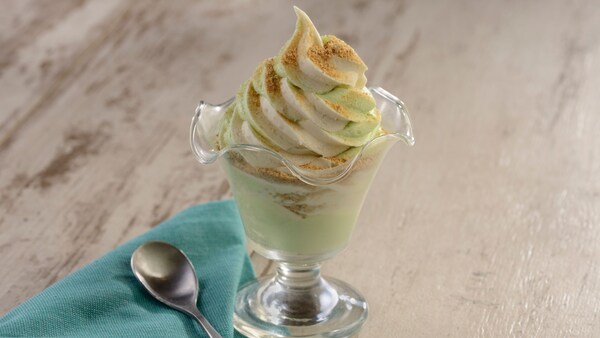 A dish of key lime DOLE Whip, a napkin and a spoon