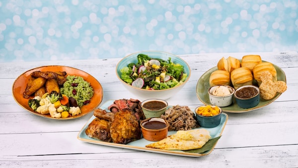 Four dishes from Sebastian's Bistro including Buttery House Baked Pull Apart Rolls, The Spice Necklace Salad, Entrée Sides and Taste of the Caribbean Entrée 