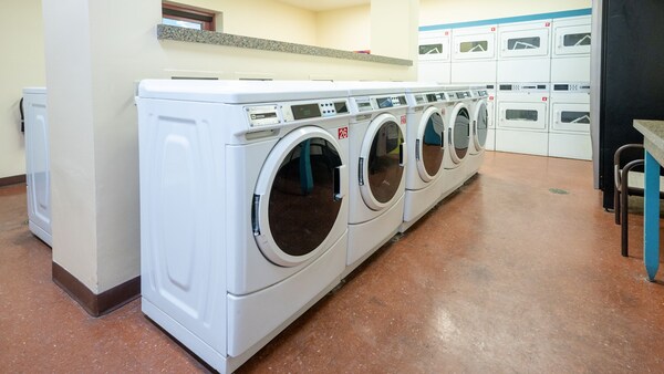 A laundry room with washing machines and dryers at Disney’s Coronado Springs Resort