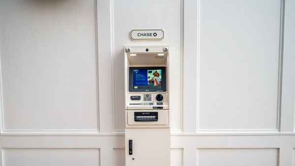 An ATM located on a paneled wall at Disney's BoardWalk Inn