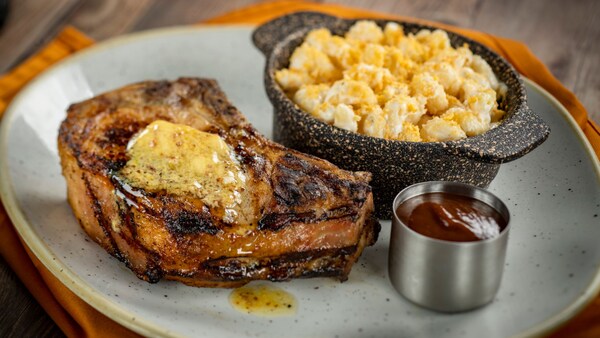 Pork chops served with mustard butter and a side dish