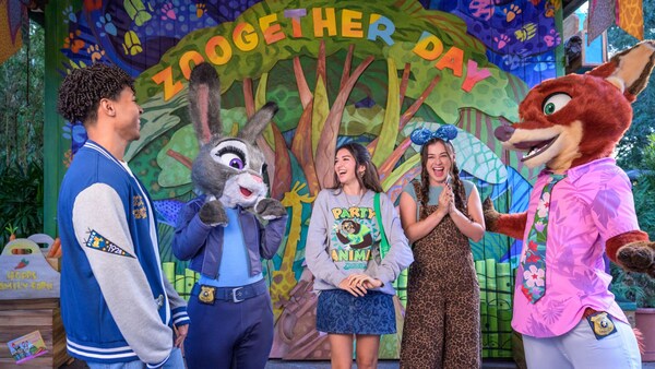 Guests meeting Judy Hopps and Nick Wilde in front of a Zootopia themed backdrop	