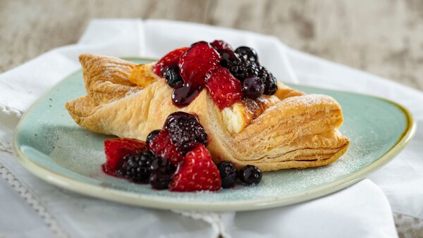 A cheese strudel topped with mixed berries