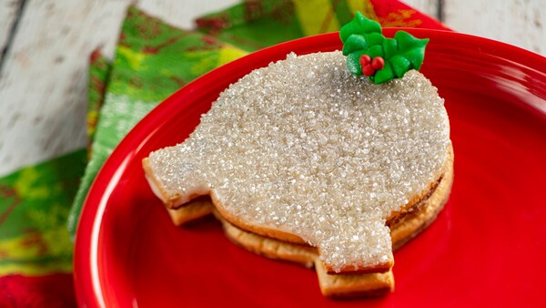 A Spaceship Earth cookie with salted caramel ganache topped with a candy mistletoe shaped like Mickey Mouse’s head