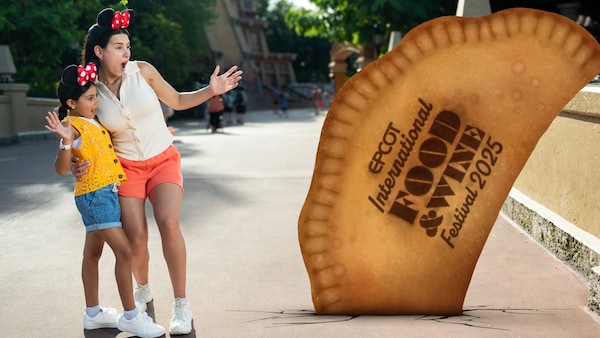 A Disney PhotoPass Magic Shot featuring 2 Guests looking at a giant empanada with text that reads ‘Epcot International Food and Wine Festival Twenty Twenty Five’