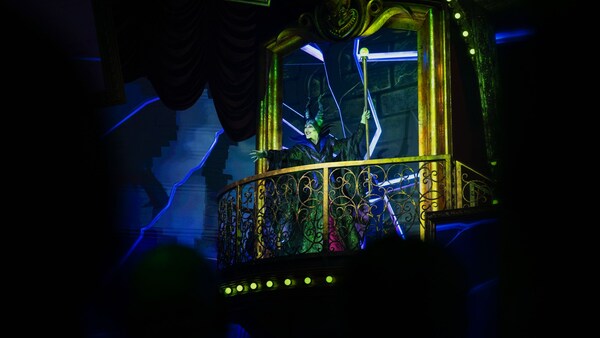 Maleficent standing on a balcony 