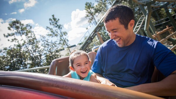 A father and daughter enjoy The Barnstormer together after using the Rider Switch option in line