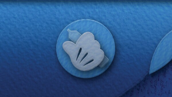 An illustration of Mickey Mouse’s hand holding a pen