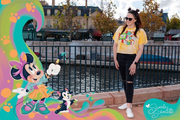 A Guest posing on the bridge next to the France Pavilion with a Magic Shot overlay by artist Sarah Schmidt of Minnie Mouse and Figaro