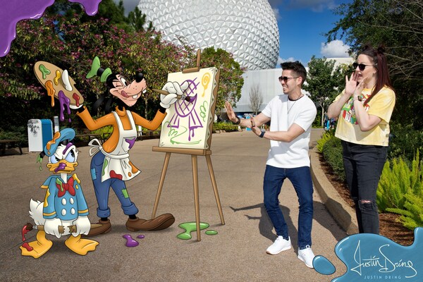 Two Guests posing in front of Spaceship Earth with a Magic Shot overlay by artist Justin Dring featuring Goofy and Donald Duck