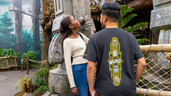 Two Guests standing near Star Tours The Adventures Continue at Disney's Hollywood Studios theme park