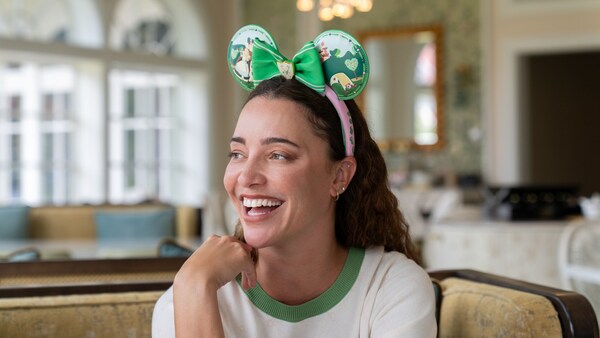 A Guest wearing an Alice in Wonderland themed ear headband at The Garden View Lounge Tea Experience