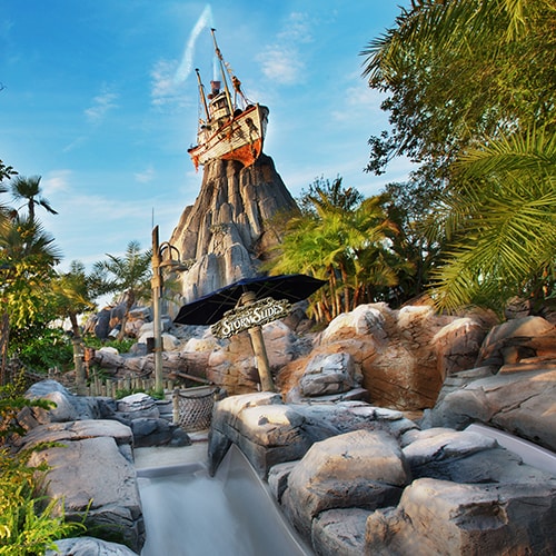 One of the 3 waterslides at Storm Slides with the Miss Tilly shrimp boat atop Mount Mayday beyond