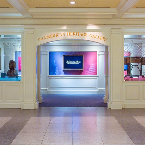 Entrance to The American Heritage Gallery at Epcot flanked by windows