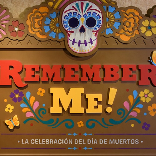 A sign that reads Remember Me La Celebracion Del Dia De Muertos