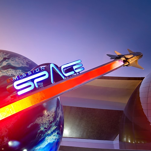 Mission: SPACE sign featuring a rocket ship speeding past Earth outside the attraction at Epcot