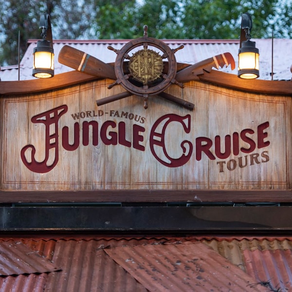 A sign saying 'World Famous Jungle Cruise Tours'