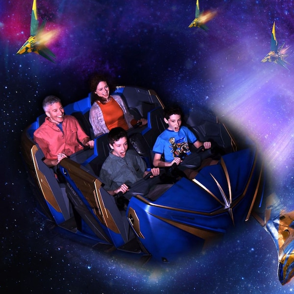 4 Guests in a Guardians of the Galaxy Cosmic Rewind ride vehicle, superimposed on artwork depicting spaceships flying across a galaxy