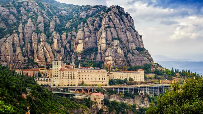 The Montserrat Monastery nestled in the stony crags of a multi peak mountain