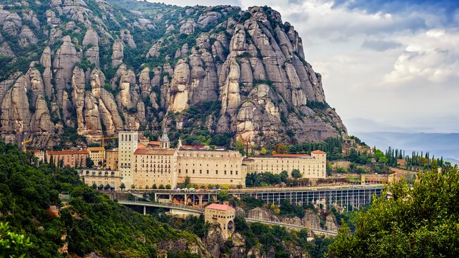 The Montserrat Monastery nestled in the stony crags of a multi peak mountain