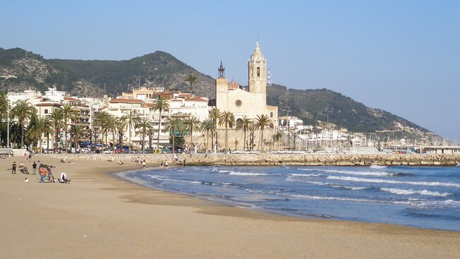 A palm lined beach in the coastal town of Sitges