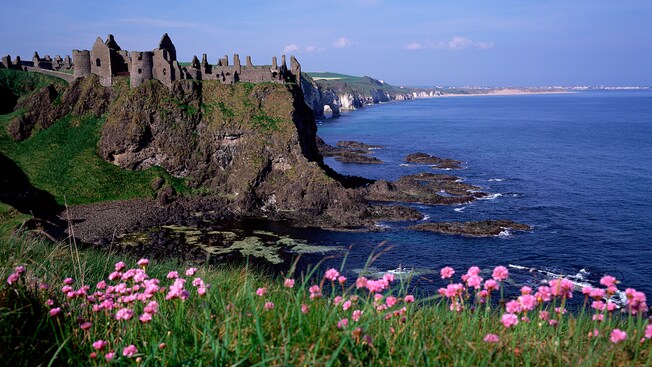 The ruins of a medieval castle on a cliff overlooking the sea