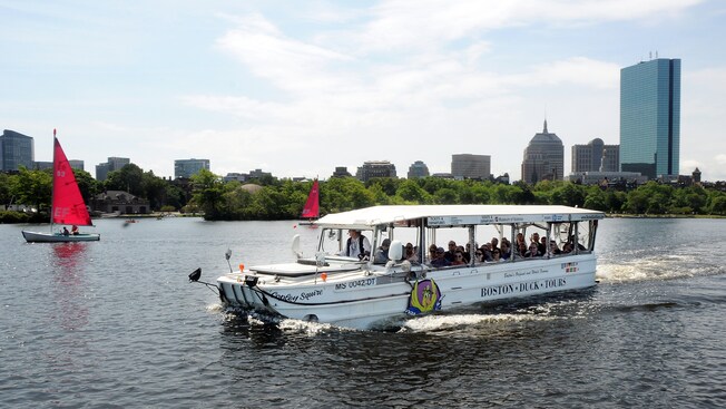 An open air amphibious DUCK vehicle gliding through the waters near Boston, Massachusetts