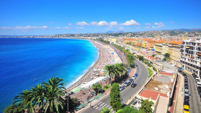 The French Riviera reveals sunny climes, crowded tree-lined beaches and historic buildings