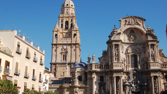 The ornate façade of the Cathedral Church of Saint Mary reveals statues, columns and a bell tower The ornate façade of the Cathedral Church of Saint Mary reveals statues, columns and a bell tower