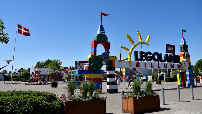 The entrance of Legoland reveals a Danish flag next to a gateway made of Lego bricks The entrance of Legoland reveals a Danish flag next to a gateway made of Lego bricks