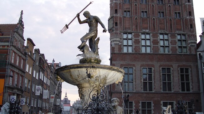 A fountain containing a statue of Neptune holding a trident