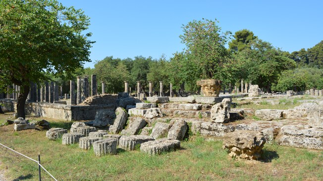 The ruins of a temple near a forest