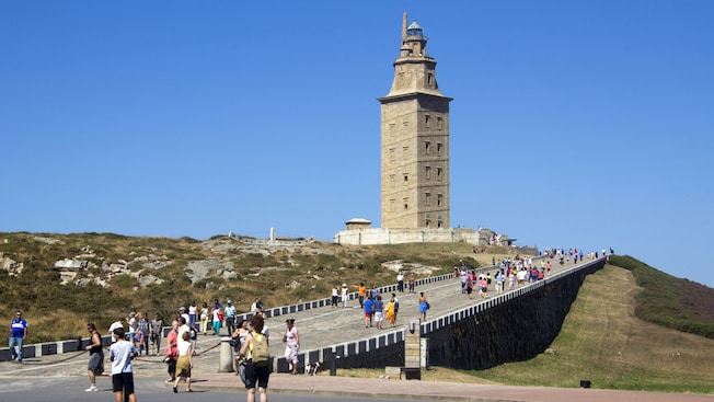 Tourists walking to and from a stone tower Tourists walking to and from a stone tower