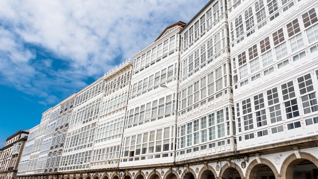 A series of multi story buildings with glass windows