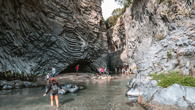 Guests explore shallow waterways at the Alcantara Gorges Guests explore shallow waterways at the Alcantara Gorges