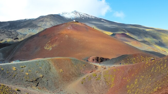Sloping hills below the monumental Mount Etna volcano on the east coast of Sicily, Italy Sloping hills below the monumental Mount Etna volcano on the east coast of Sicily, Italy