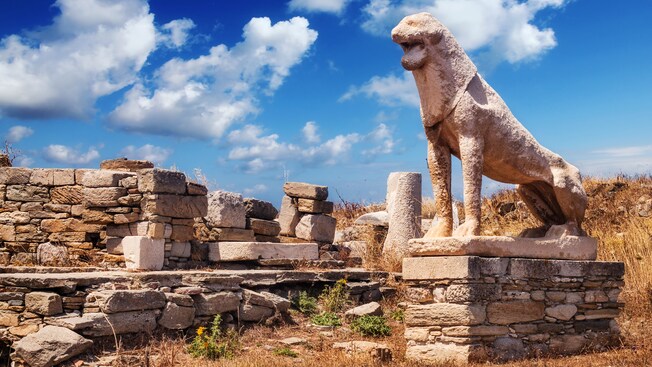 A stone lion statue in an arid coastal environment