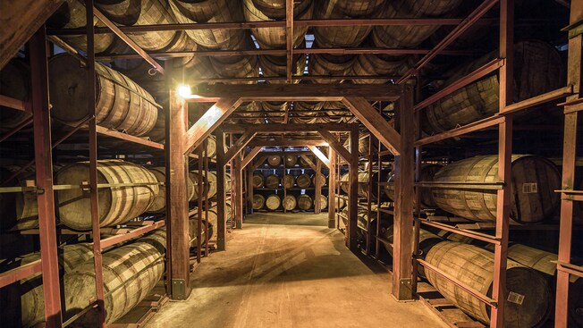 Barrels of rum aging in a cellar