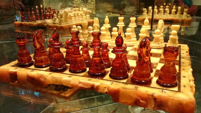 A chess set made from amber and marble