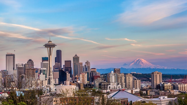 The Seattle skyline near a snowcapped mountain