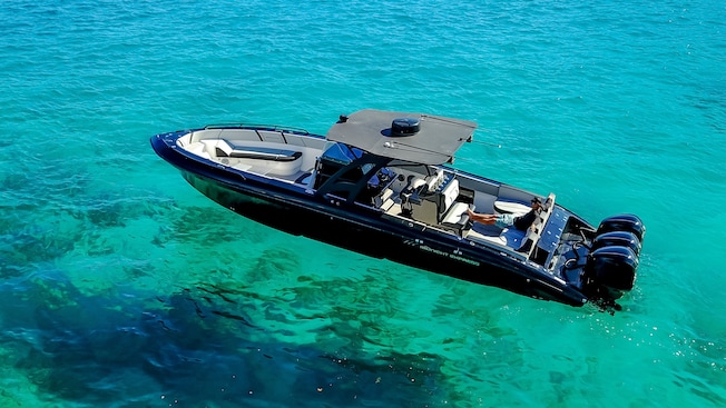 A speedboat anchored in the water A speedboat anchored in the water