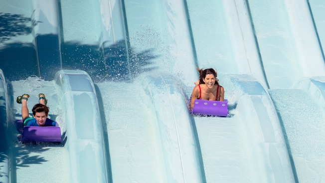  A mother and son race down the long waterslides of Toboggan Racers