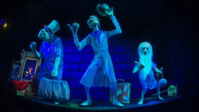 A scene from the Haunted Mansion ride featuring the Hitchhiking Ghosts