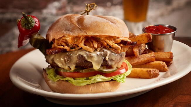 A plate of burger, fries and ketchup
