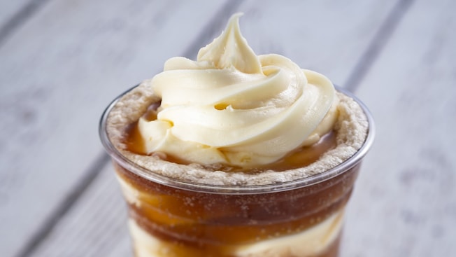 Soft ice cream and soda are paired in a plastic cup