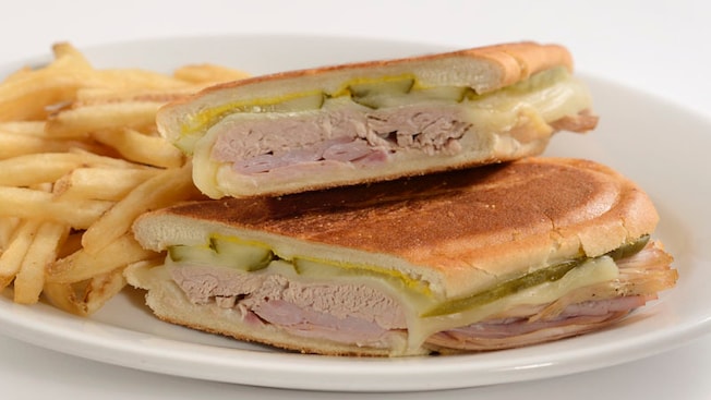 A plate of the Cuban sandwich with a side of fries